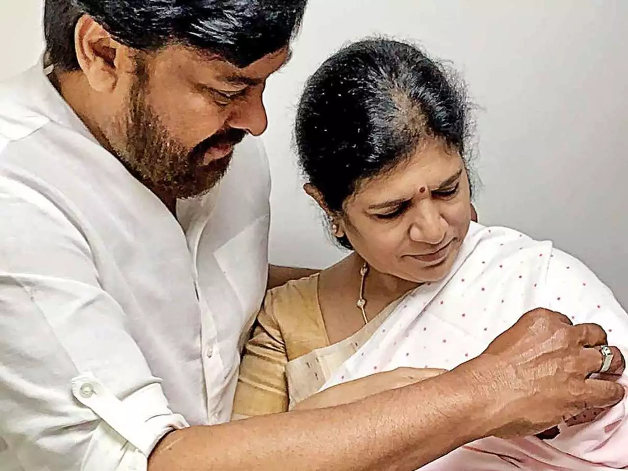 Chiranjeevi holds tiny granddaughter in his arms